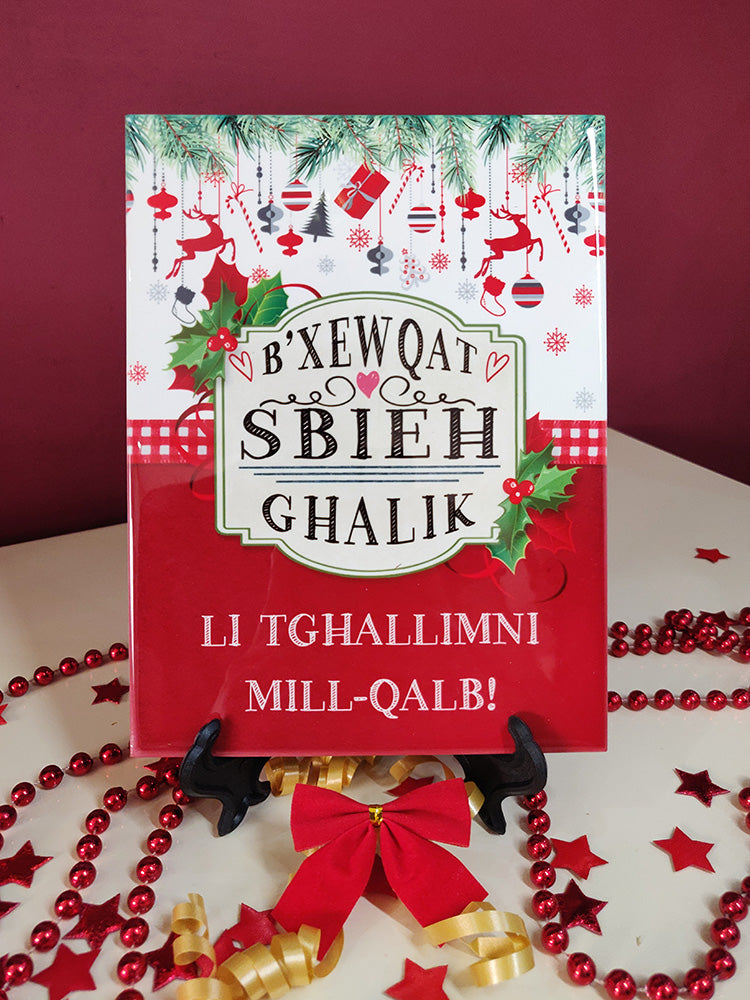 Maduma dekorattiva tal-Milied għall-Għalliema fuq sfond aħmar bit-tiżjin